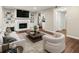 Bright living room features fireplace, built-in bookshelves, and modern furnishings at 95 Ivy Ne Trl, Atlanta, GA 30342