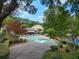 A kidney-shaped swimming pool with lounge chairs and lush landscaping in a residential community at 95 Ivy Ne Trl, Atlanta, GA 30342