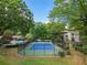 A well-maintained community tennis court is framed by mature trees and lush landscaping at 95 Ivy Ne Trl, Atlanta, GA 30342