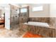 Bathroom with a large soaking tub and separate shower at 953 Auburn Rd, Dacula, GA 30019