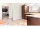 Bathroom view featuring double sinks, granite countertops, and a walk-in closet at 953 Auburn Rd, Dacula, GA 30019