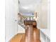 A welcoming foyer with hardwood floors, a staircase, and views into the living room at 953 Auburn Rd, Dacula, GA 30019