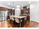 A modern kitchen with stainless steel appliances, granite countertops, and a center island at 953 Auburn Rd, Dacula, GA 30019