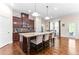 Kitchen featuring a large island with seating and a view of the outdoor area at 953 Auburn Rd, Dacula, GA 30019