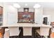 Spacious kitchen featuring a large island with seating, granite countertops, and ample storage at 953 Auburn Rd, Dacula, GA 30019