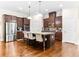 A modern kitchen with stainless steel appliances, granite countertops, and a center island at 953 Auburn Rd, Dacula, GA 30019