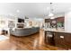 The open-concept living space combines the living room with the kitchen and its granite island at 953 Auburn Rd, Dacula, GA 30019