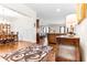 Elegant living room showcasing hardwood floors and open layout to dining area at 953 Auburn Rd, Dacula, GA 30019