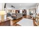 An open concept floor plan includes hardwood floors and integrates the living room and kitchen at 953 Auburn Rd, Dacula, GA 30019