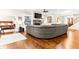 A spacious living room featuring a fireplace, built-in shelves, and hardwood floors at 953 Auburn Rd, Dacula, GA 30019
