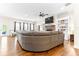 The living room features a large sectional couch, ceiling fan, and a view to the backyard at 953 Auburn Rd, Dacula, GA 30019