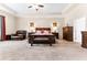 Spacious main bedroom features a tray ceiling, sitting area, and an abundance of natural light at 953 Auburn Rd, Dacula, GA 30019