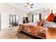 Inviting main bedroom features a ceiling fan and access to an ensuite bathroom at 953 Auburn Rd, Dacula, GA 30019