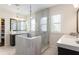 Bright bathroom with dual vanities, glass enclosed shower, and decorative tile at 1085 Celebration Dr, Roswell, GA 30076