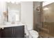 Bathroom featuring a glass enclosed shower, vanity with dark cabinets, and marble countertop at 1085 Celebration Dr, Roswell, GA 30076
