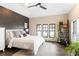 A serene bedroom with a neutral palette, decorative accent wall, and natural light at 1085 Celebration Dr, Roswell, GA 30076