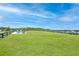 Well-maintained community dog park with ample green space, fencing, and seating area for residents' enjoyment at 1085 Celebration Dr, Roswell, GA 30076