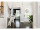 Inviting foyer with hardwood floors, stylish decor, and a view into the dining room at 1085 Celebration Dr, Roswell, GA 30076