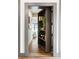 Hallway showcasing a hidden bookshelf door leading into another room at 1085 Celebration Dr, Roswell, GA 30076