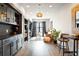 Stylish living room with wood floors, bar area, and shelving perfect for entertaining and relaxation at 1085 Celebration Dr, Roswell, GA 30076