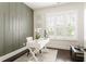 Bright home office with custom wall accents, white desk, and plantation shutters at 1085 Celebration Dr, Roswell, GA 30076