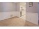 Inviting living area featuring plush carpet, chair rail and an open view to the adjoining kitchen area at 115 Plantation Dr, Clarkston, GA 30021