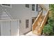 Basement entrance with white doors and wooden stairs leading to the upper level at 4524 Shumart Dr, Snellville, GA 30039