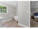 Bright and airy bathroom showcasing a modern soaking tub and a view into the bedroom at 4524 Shumart Dr, Snellville, GA 30039