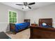 Bedroom with two twin beds, a ceiling fan, and a window at 4524 Shumart Dr, Snellville, GA 30039