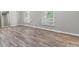 Bedroom with neutral walls, wood floors, large windows offering great natural light at 4524 Shumart Dr, Snellville, GA 30039