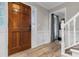 Inviting foyer with hardwood floors, white wainscoting, and a decorative glass front door at 4524 Shumart Dr, Snellville, GA 30039
