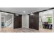 Open-concept living space featuring barn doors, wood floors, and inviting atmosphere at 4524 Shumart Dr, Snellville, GA 30039
