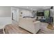 Bright and airy living room with hardwood floors, neutral decor, and large windows at 4524 Shumart Dr, Snellville, GA 30039