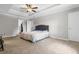 Spacious main bedroom featuring carpet flooring, recessed ceiling, and walk-in closet at 4524 Shumart Dr, Snellville, GA 30039