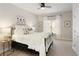 Well-lit bedroom with neutral tones, cozy bedding, and ample space at 4674 Lakeway Pl, Alpharetta, GA 30005