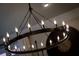 Close up of a dining room's chandelier, highlighting its modern design and soft lighting at 4674 Lakeway Pl, Alpharetta, GA 30005