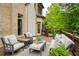 Outdoor deck area showcasing comfortable seating, perfect for entertaining and relaxing in a serene environment at 4674 Lakeway Pl, Alpharetta, GA 30005