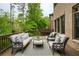 Relaxing deck area with comfortable seating, perfect for outdoor entertaining and enjoying the surrounding greenery at 4674 Lakeway Pl, Alpharetta, GA 30005