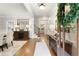 Elegant foyer with hardwood floors, decorative console table, staircase, and abundant natural light at 4674 Lakeway Pl, Alpharetta, GA 30005