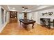 Basement game room featuring a pool table, custom shelving, and a bar table and chairs at 4674 Lakeway Pl, Alpharetta, GA 30005