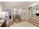 Open hallway featuring hardwood floors, a wooden banister, and views into adjacent rooms, creating a spacious feel at 4674 Lakeway Pl, Alpharetta, GA 30005