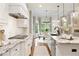 Bright kitchen features granite countertops, stainless steel appliances, white cabinetry, and gas cooktop at 4674 Lakeway Pl, Alpharetta, GA 30005