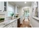 Bright kitchen features granite countertops, white cabinetry, and a beverage cooler at 4674 Lakeway Pl, Alpharetta, GA 30005