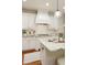 Bright kitchen features granite countertops, stainless steel appliances, white cabinetry, and range hood at 4674 Lakeway Pl, Alpharetta, GA 30005