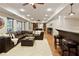 Open basement layout with a living room, bar area, and a pool table for a perfect entertainment space at 4674 Lakeway Pl, Alpharetta, GA 30005