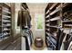 Well-organized walk-in closet with custom shelving, hanging racks and natural light at 4674 Lakeway Pl, Alpharetta, GA 30005
