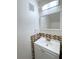 Updated bathroom featuring a white vanity, mosaic backsplash, and a modern mirror with lighting at 1812 Ashborough Se Cir # C, Marietta, GA 30067
