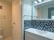 Bathroom featuring modern fixtures, a mirror, and a convenient towel rack for everyday comfort at 1812 Ashborough Se Cir # C, Marietta, GA 30067