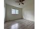 Well-lit bedroom with hardwood flooring and a ceiling fan providing comfort and style at 1812 Ashborough Se Cir # C, Marietta, GA 30067