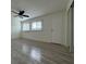 Bedroom featuring hardwood flooring, windows and a ceiling fan at 1812 Ashborough Se Cir # C, Marietta, GA 30067